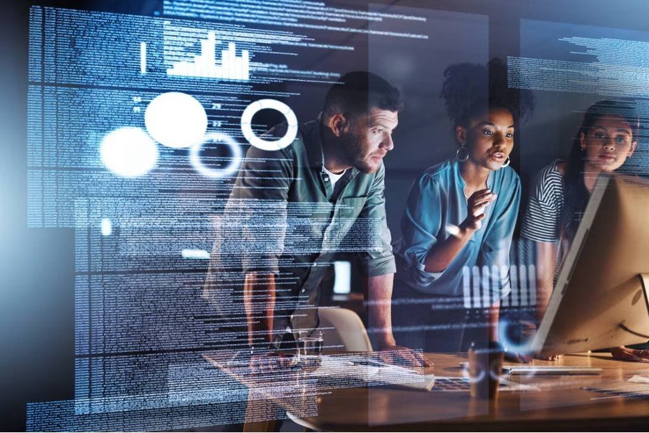 three people working on codes